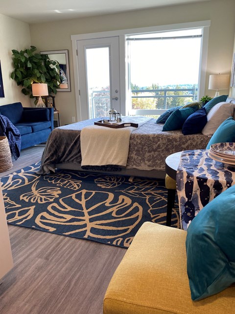 a living room with a bed and a couch